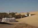 This sand dune is swallowing the village of Riz at the speed of several decimetres a year. Many ancient monuments can be found under such desert formations.